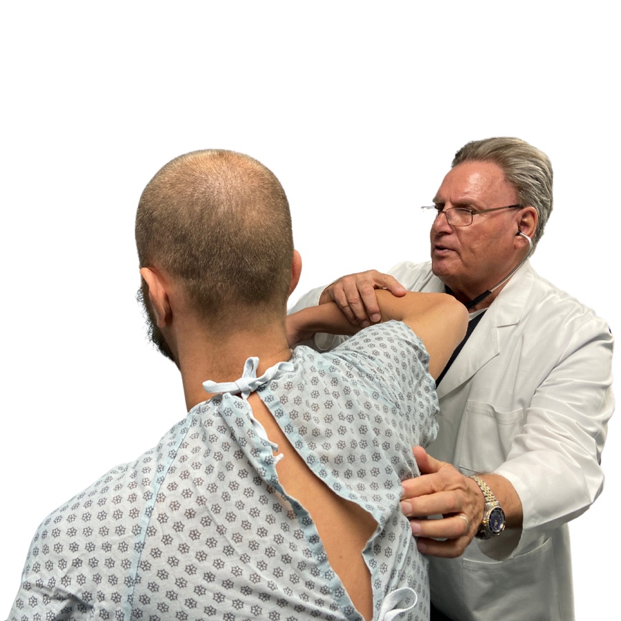 A Medical Center Plus doctor examining a patient's shoulder in the Auburn clinic